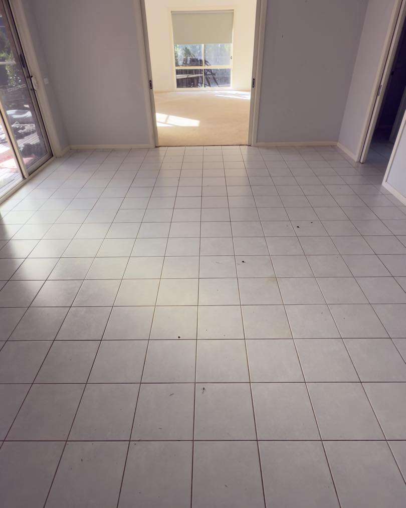 Open room of tiles ready to have hybrid flooring installed