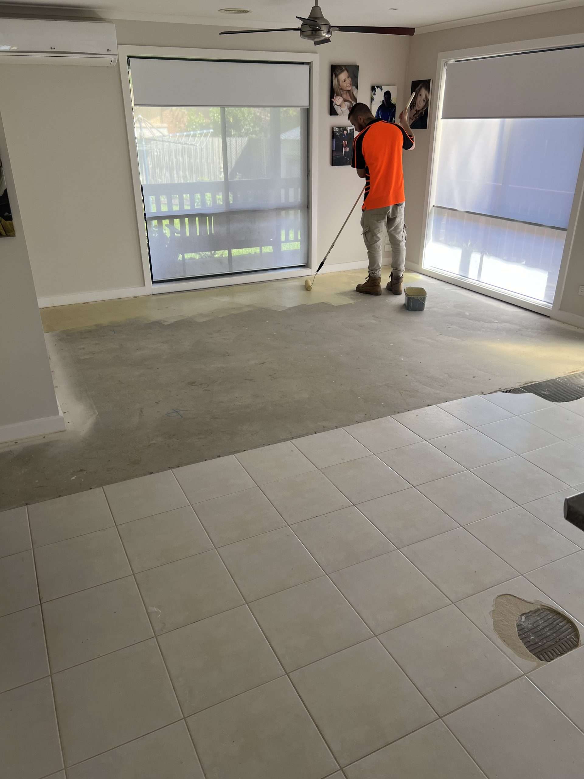 Here we have an installer rolling on a primer before pouring a floor leveler.